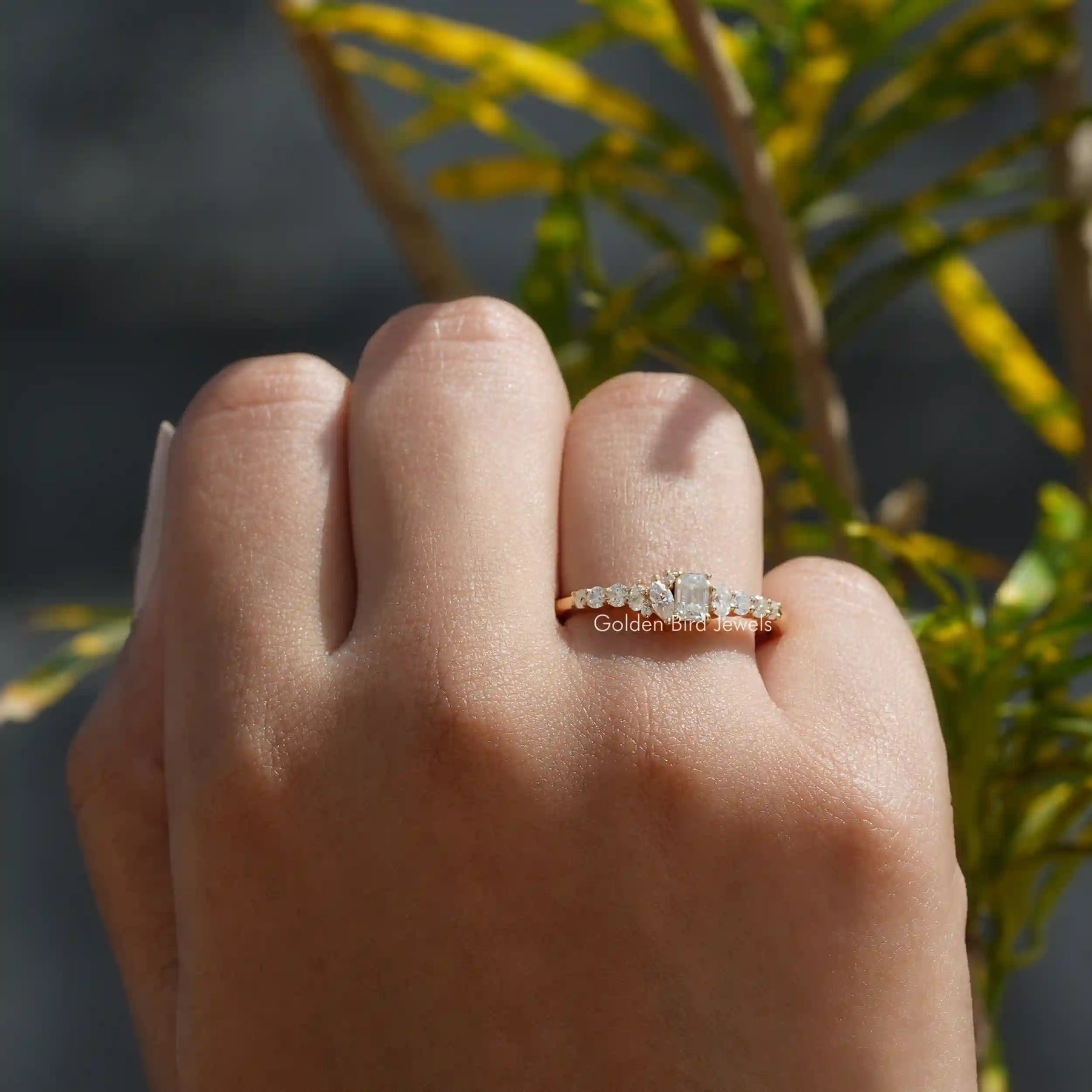 [In finger front view of emerald cut moissanite eternity band crafted with multi stones]-[Golden Bird Jewels]