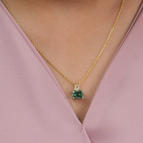 [In neck front view of yellow gold emerald cut moissanite pendant crafted with vvs clarity]-[Golden Bird Jewels]