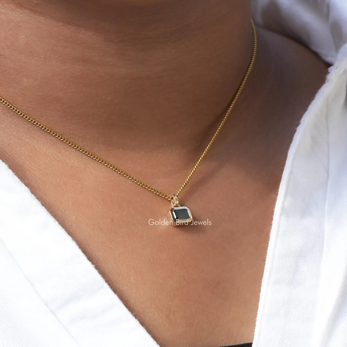 [In neck front view of green emerald cut moissanite pendant]-[Golden bird Jewels]
