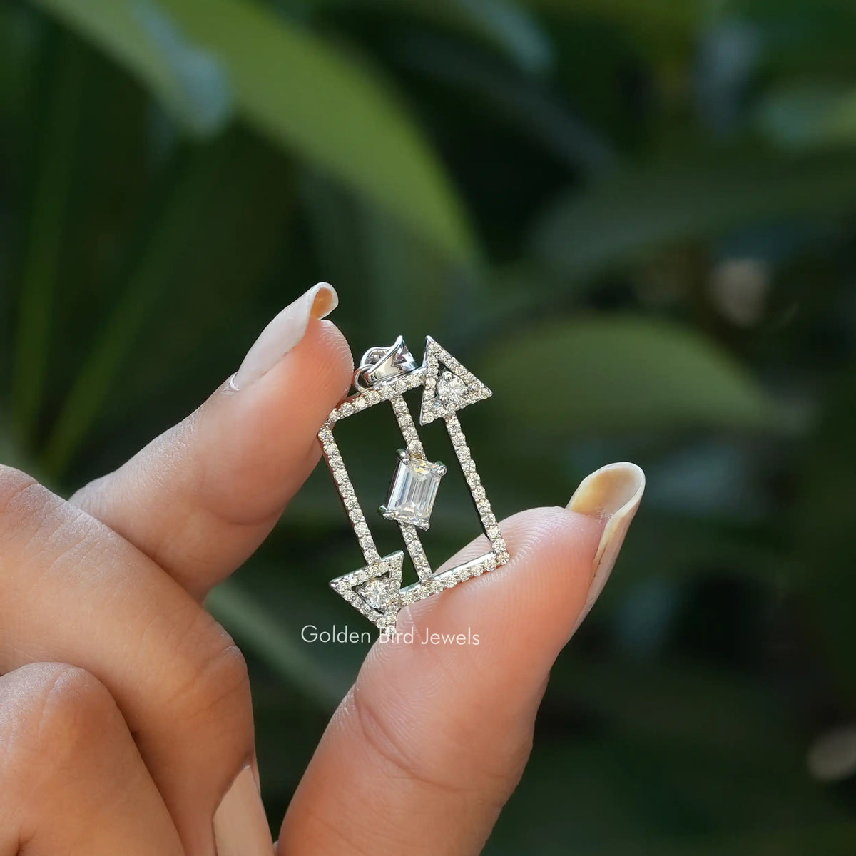 Front view of emerald cut moissanite pendant made of white gold