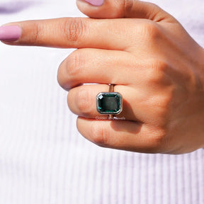 Close-Up View of Emerald Cut Solitaire Ring In White Gold