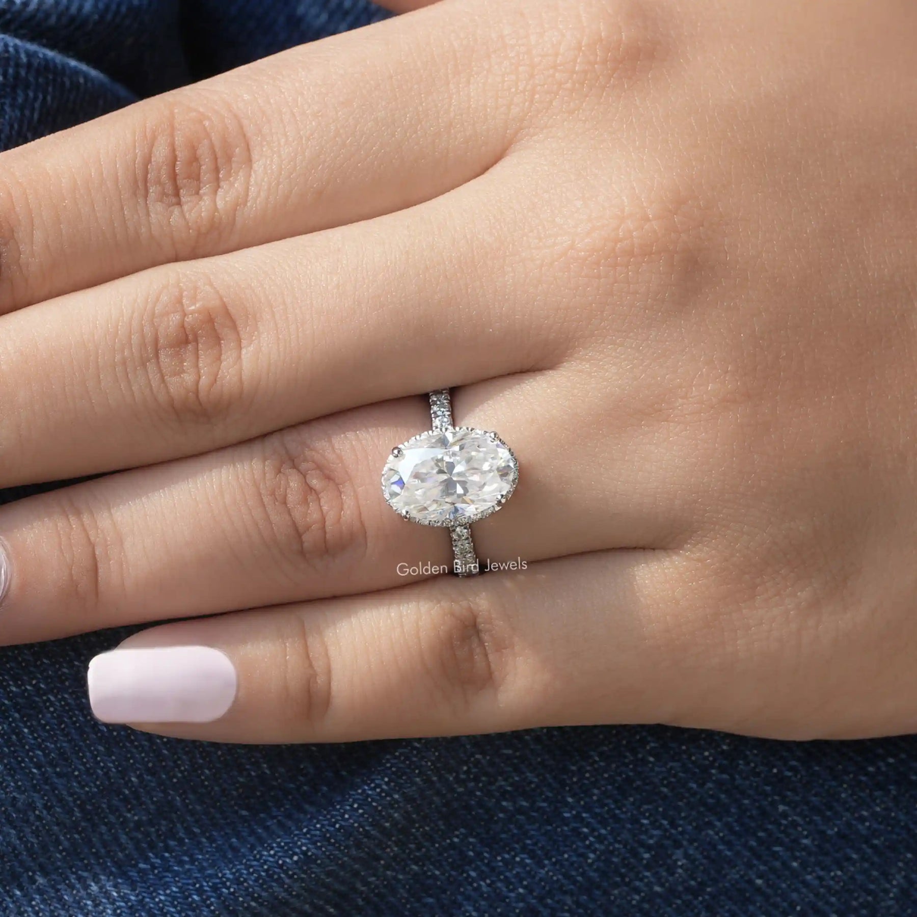 [In finger front view of oval cut engagement ring with 14k white gold]-[Golden Bird Jewels]