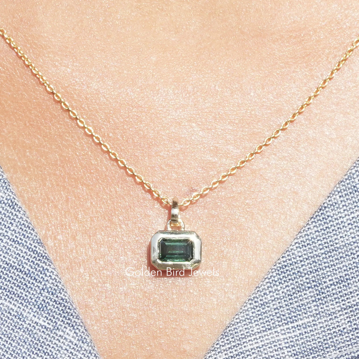 Dark green emerald-cut moissanite solitaire pendant