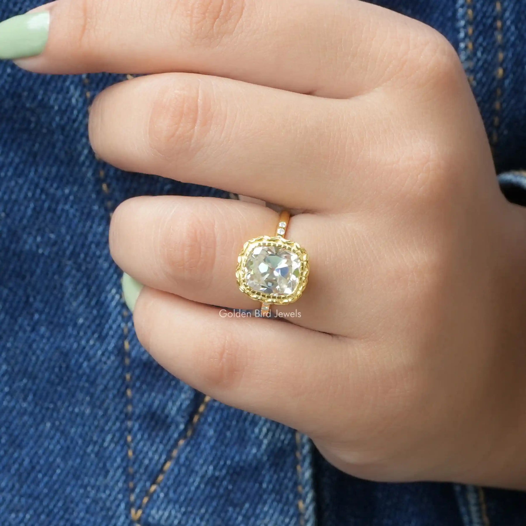 [In finger front view of cushion cut moissanite ring]-[Golden Bird Jewels]