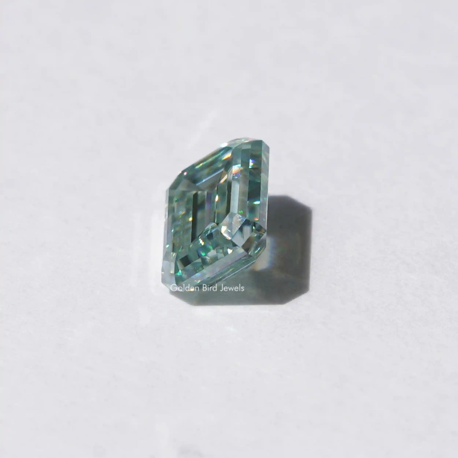 [Side view of emerald cut loose moissanite made of vs clarity]-[Golden Bird Jewels]