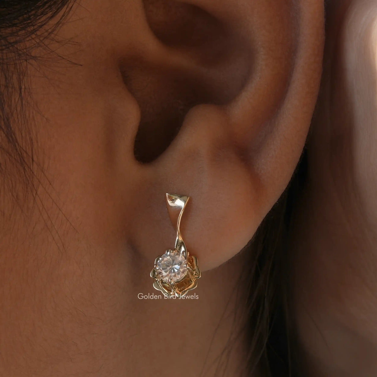 Side view of round cut cluster moissanite earrings