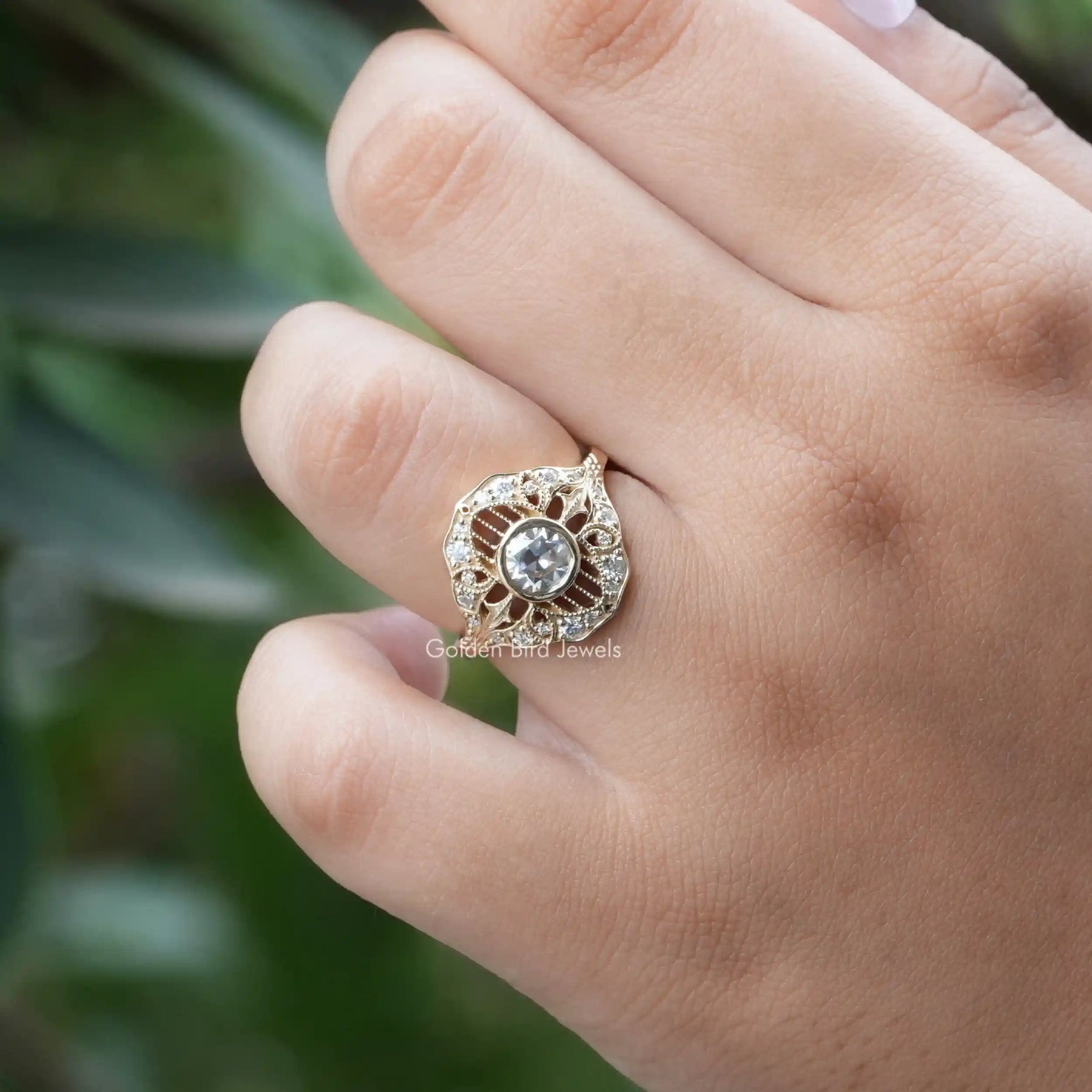 [In finger front view of round cut moissanite ring]-[Golden Bird Jewels]