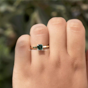 Close-Up View of Moissanite Green Asscher Cut Ring In Yellow Gold
