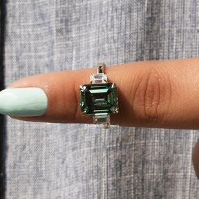 In finger front View of Green Emerald Cut Moissanite Ring