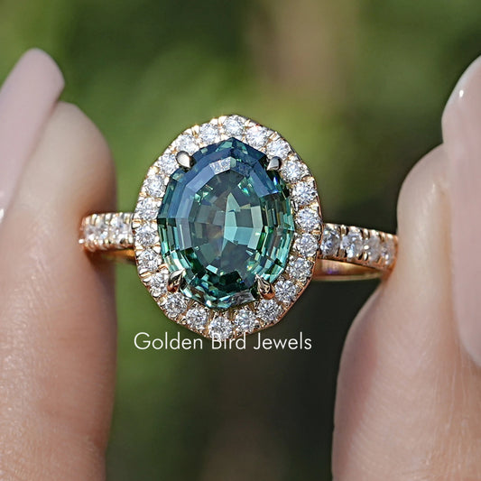 Front view of Step Cut Oval Moissanite Halo Accent Ring