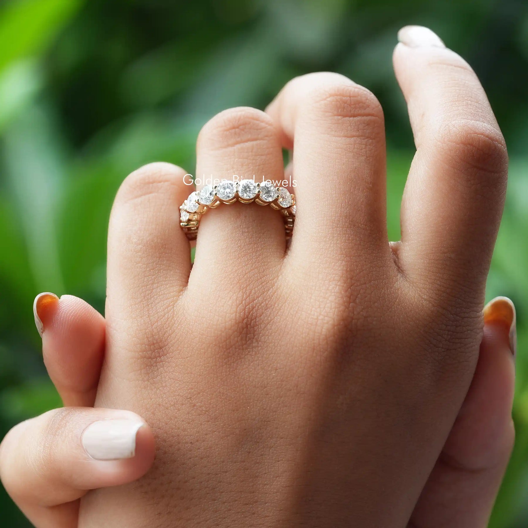 [Slightly cross finger front view of half round and emerald cut moissanite wedding band]-[Golden Bird Jewels]