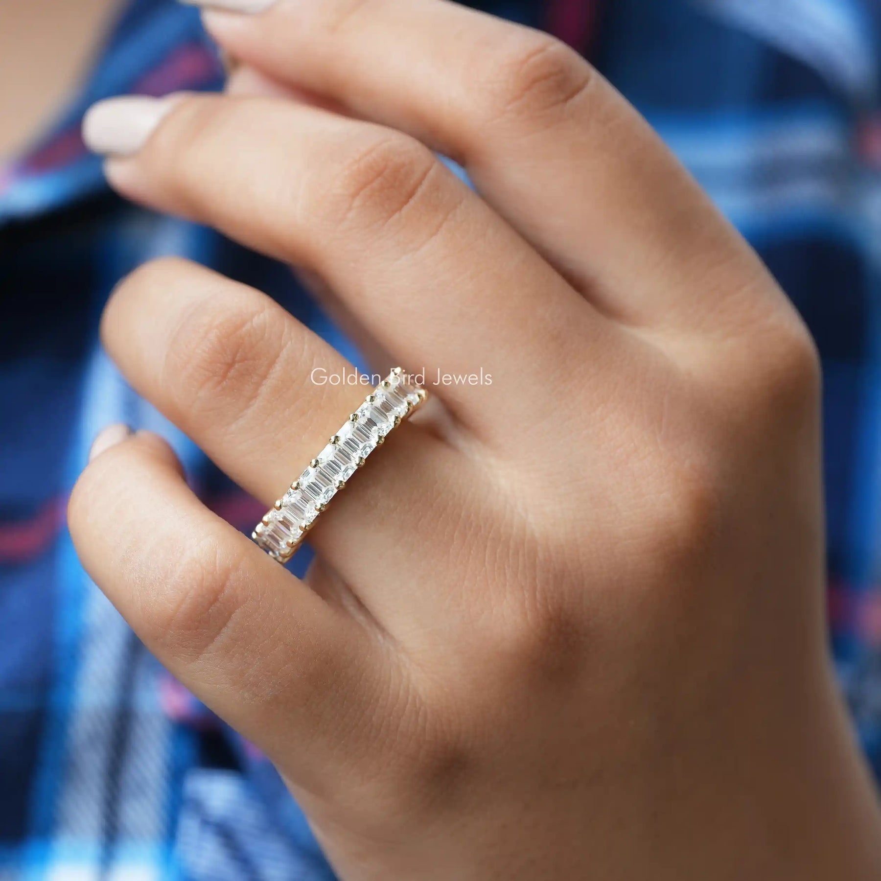 [In finger front view of emerald and round cut moissanite band set in white gold]-[Golden Bird Jewels]