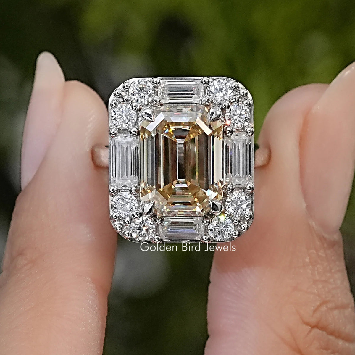 Sterling silver moissanite halo ring with a rectangular center stone and baguette and round accents