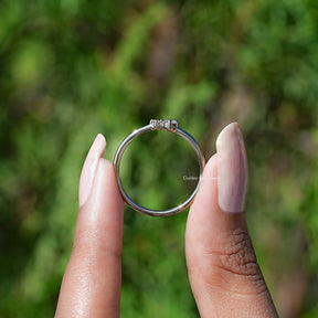 Back View of Round Cut Diamond Solitaire Toi Et Moi Ring In two fingers