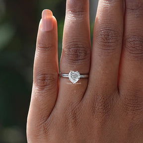 View of Heart Cut Hidden Halo Moissanite Ring In Finger