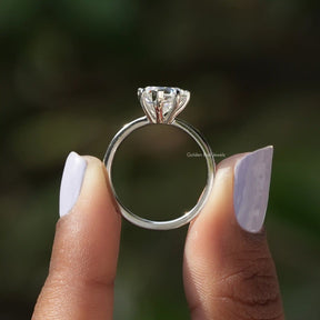 Back View of Heart Shaped Diamond Engagement Ring In two fingers