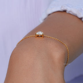 In hand showing a view of halo chain bracelet 