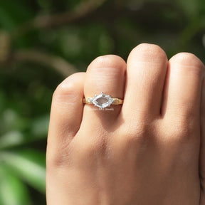 Close-Up View of Hidden Halo Step Cut Marquise Moissanite Ring In Yellow Gold