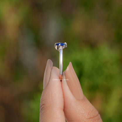 Sterling silver prong setting ring with blue pear-cut moissanite stone