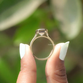 Back View of Radiant Cut Bezel Set Solitaire Ring In two fingers