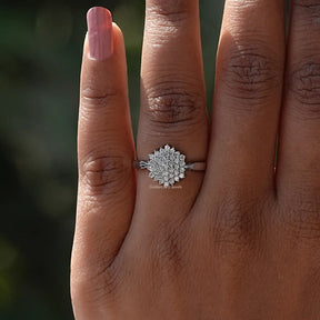 White gold ring with round lab-grown diamonds worn on finger.