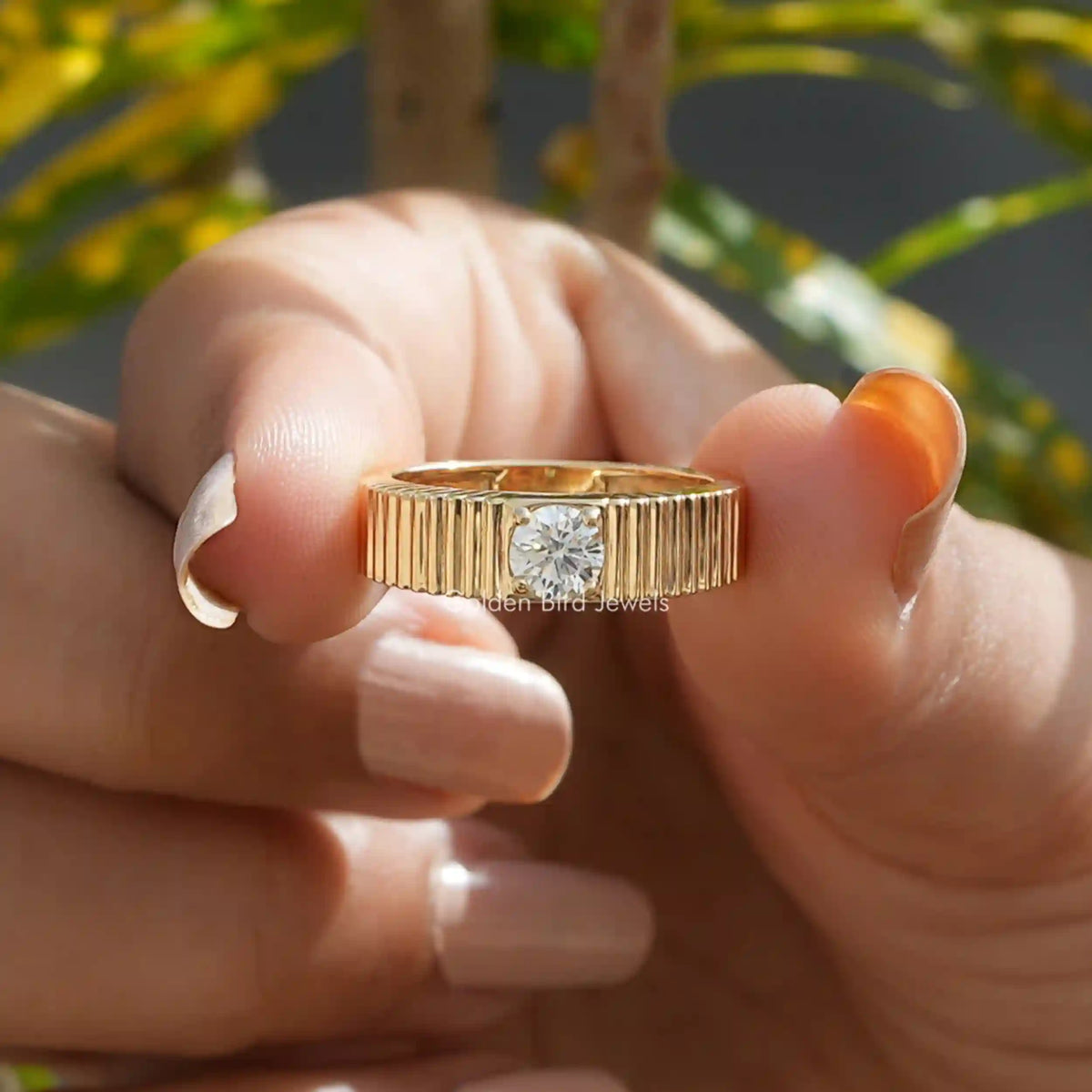 Front View of  Round Cut Solitaire Engagement Ring In two Fingers