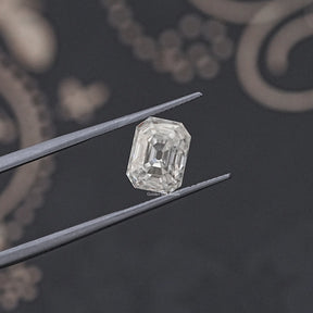tweezers  View of Timeless Old Mine Cut Emerald Moissanite Loose Gemstone with colorless clarity