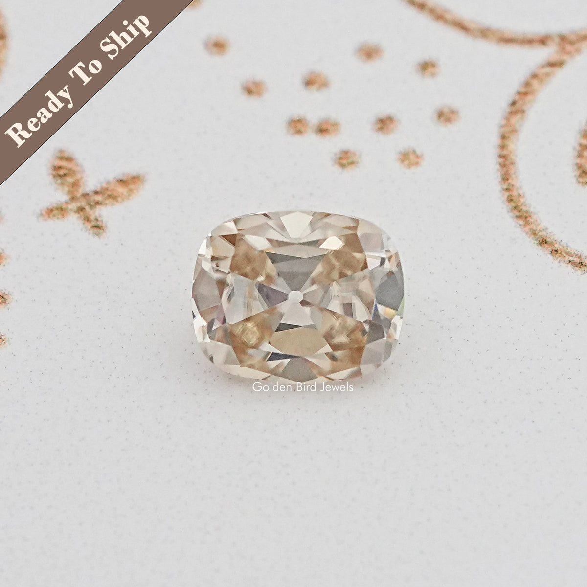 Cushion-cut moissanite gemstone with faceted sparkle, loose yellow tone
