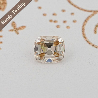 Cushion-cut loose gemstone with golden tones, faceted