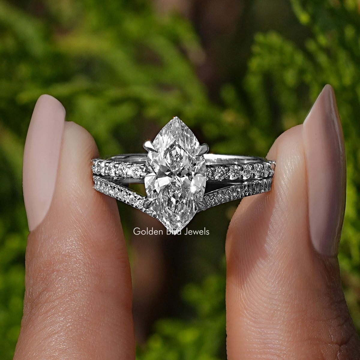 Front view of Marquise Cut Lab Diamond Bridal Ring Set in two fingers