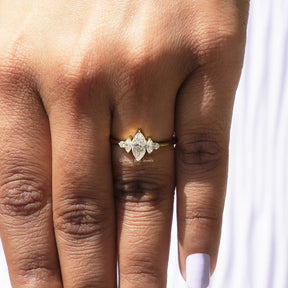 View of Moissanite Marquise And Round Cut Engagement Ring In Yellow Gold