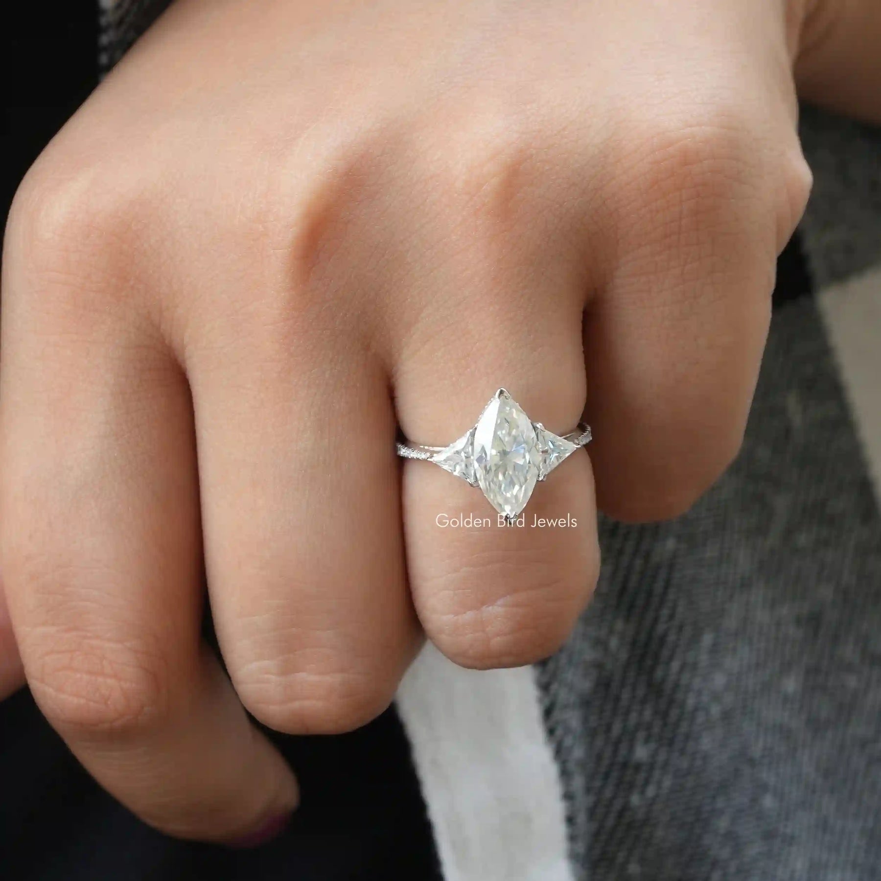 [In Finger a Colorless Moissanite 3-Stone Engagement Ring In Claw Prong Setting]-[Golden Bird Jewels]