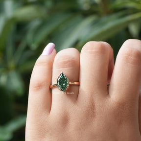[In finger front view of green marquise cut engagement ring in 14k yellow gold]-[Golden Bird Jewels]