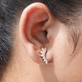 [In ear front view of marquise cut moissanite stud earrings crafted with yellow gold]-[Golden Bird Jewels]