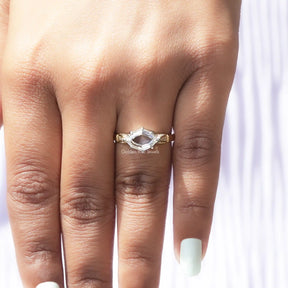 View of Marquise Step Cut Hidden Halo Moissanite Ring In Yellow Gold