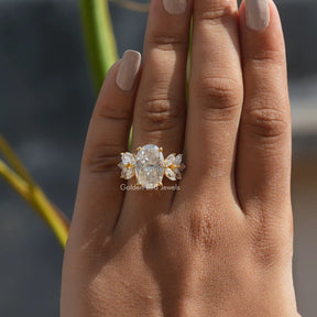 [In finger front view of oval cut moissanite ring in 14k yellow gold]-[Golden Bird Jewels]