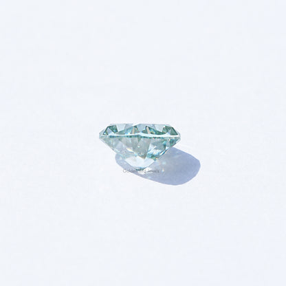 Light blue moissanite gemstone, cushion old mine cut, loose side view