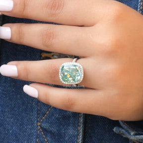 View of Cushion Cut Halo Engagement Ring In Finger