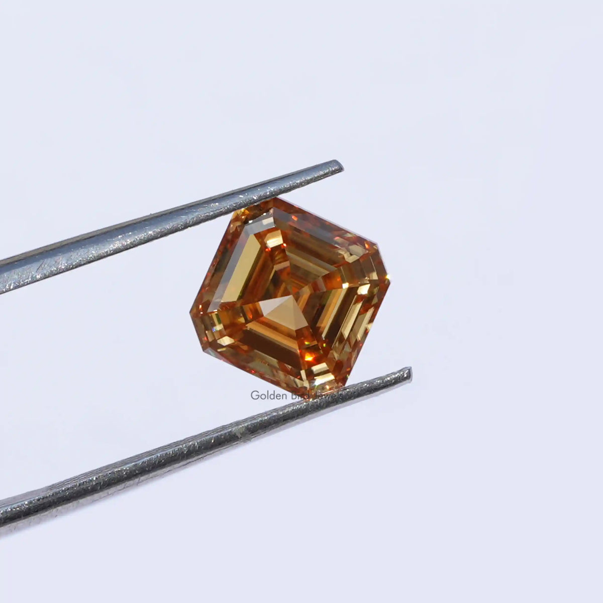 Twijer holding the Moissanite Asscher Cut Loose Stone   