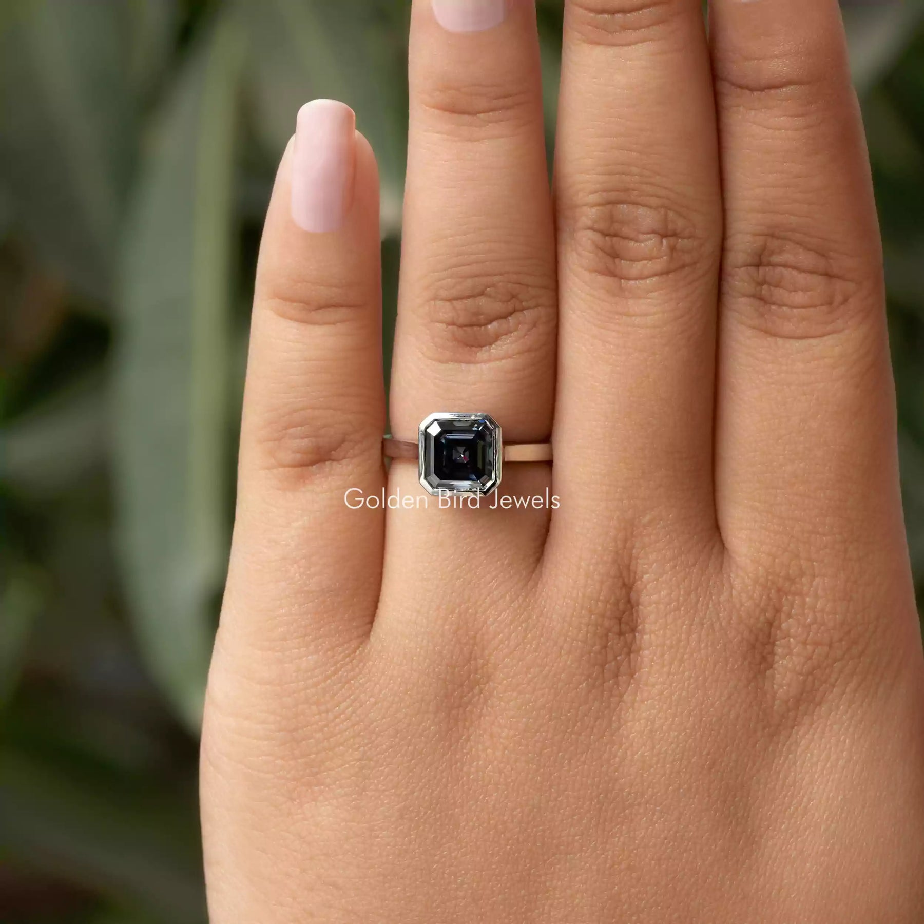 [In finger front view of bezel set moissanite ring]-[Golden Bird Jewels]