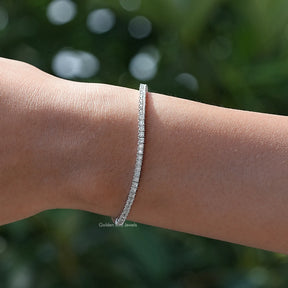 Top view of moissanite tennis bracelet in secure setting 
