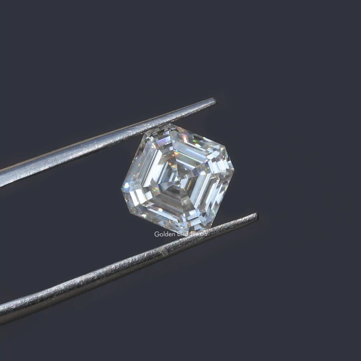 Tweezer holding the Colorless Asscher Cut Loose Moissanite