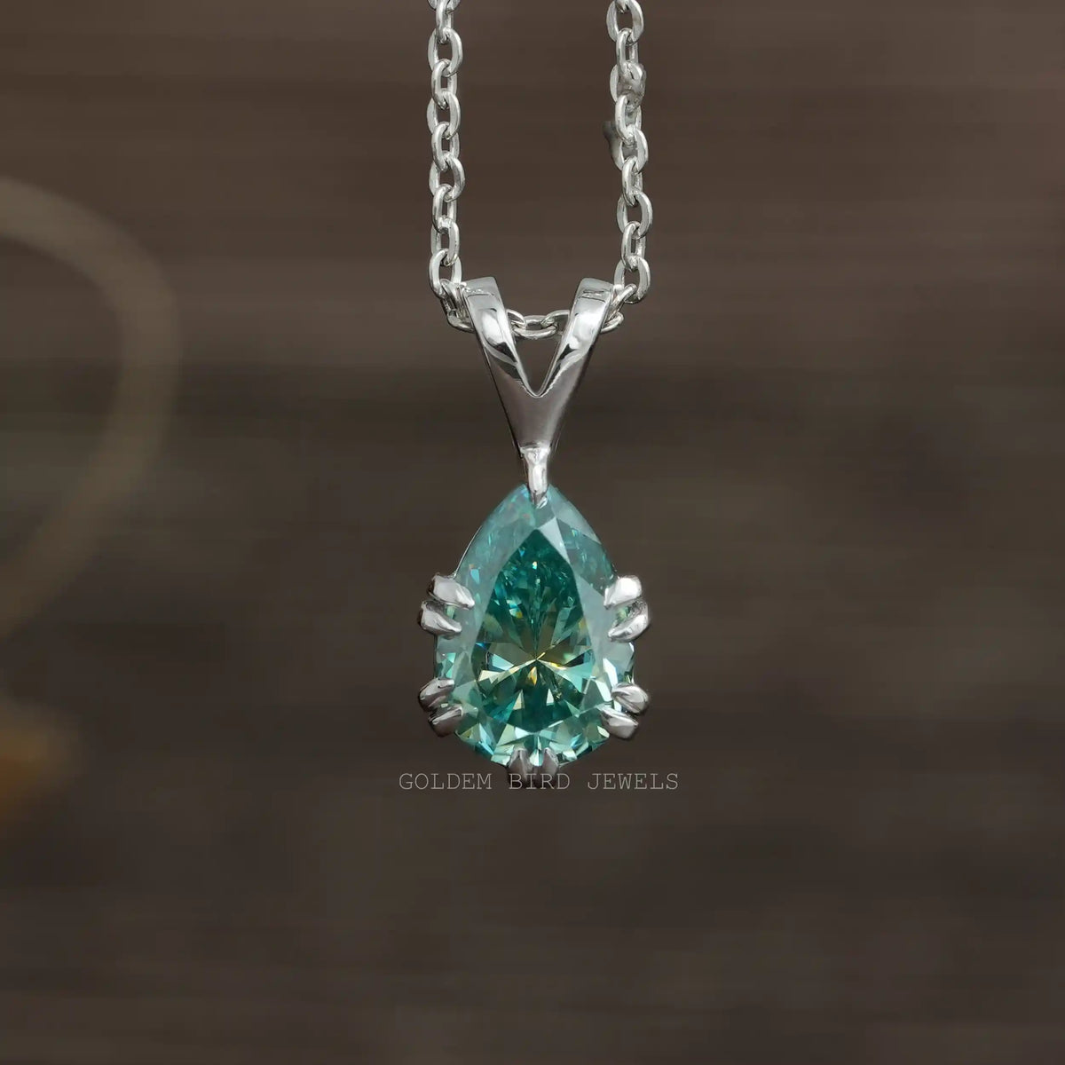 [Front view of blue pear cut moissanite pendant in 14k white gold]-[Golden Bird Jewels]