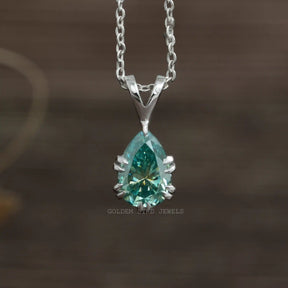 Front view of blue pear cut moissanite pendant in 