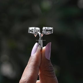 Side View of Butterfly And Marquise Cut Moissanite Bypass Ring In two fingers