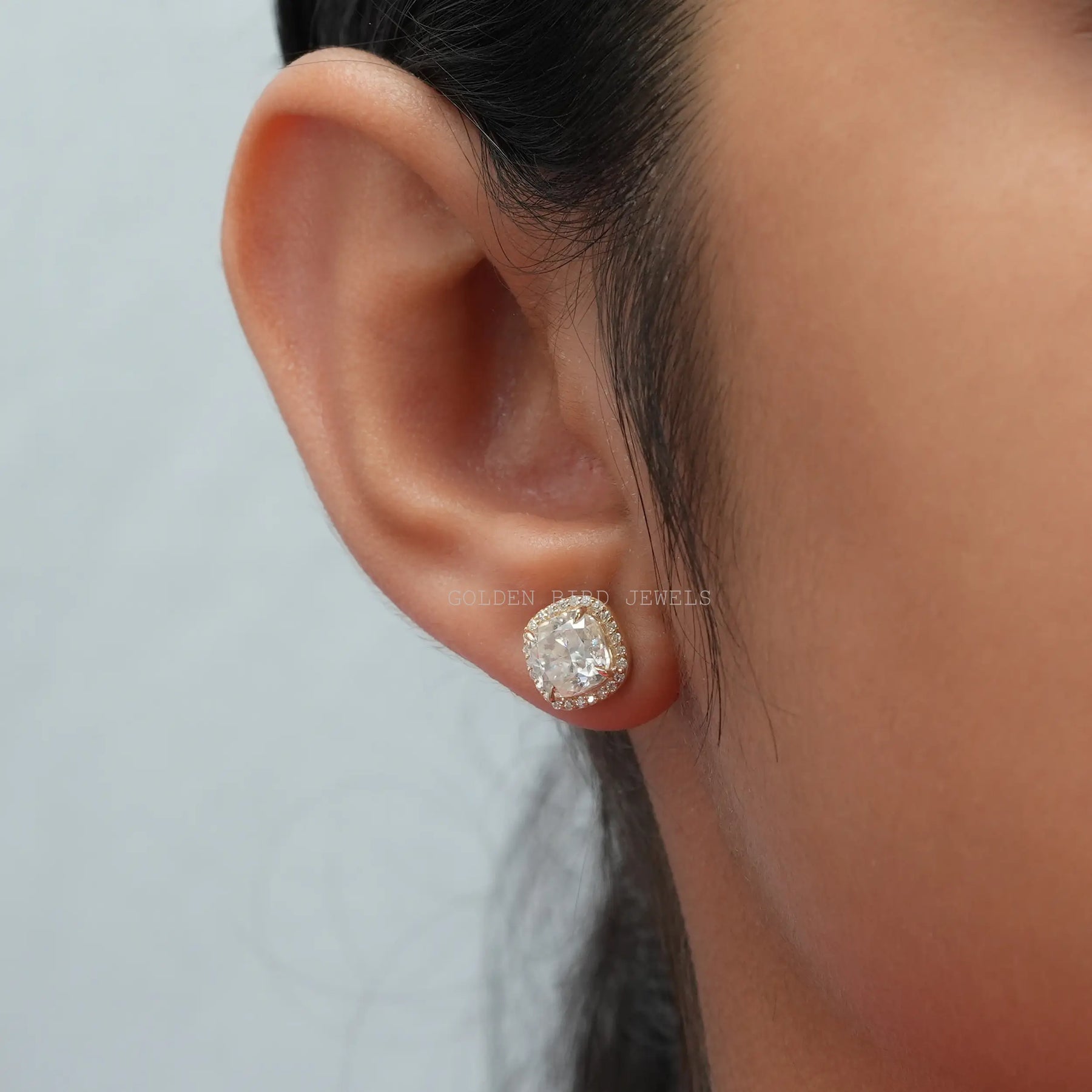 [In ear front view of moissanite cushion halo stud earrings]-[Golden Bird Jewels]