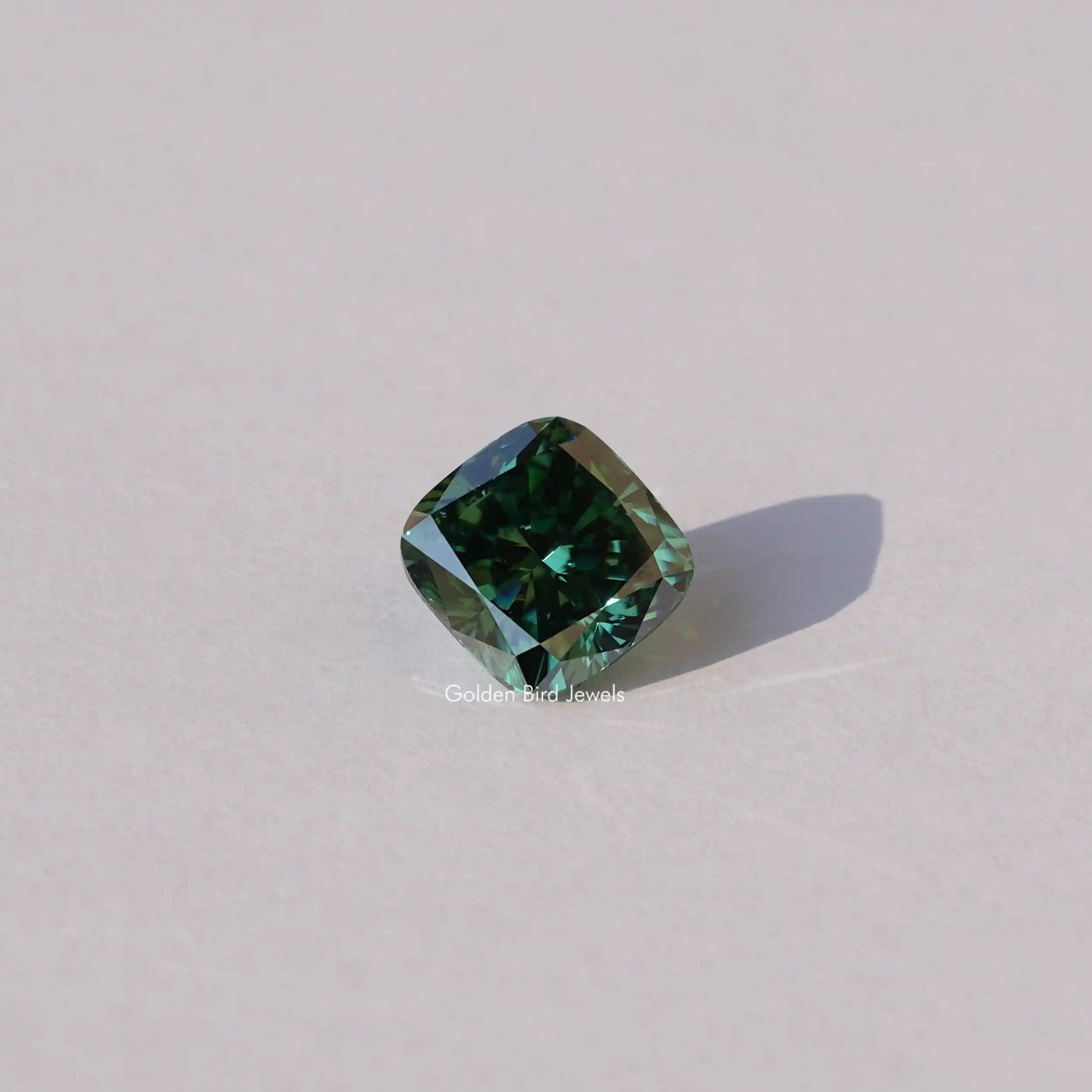 [Front view of dark green cushion cut loose moissanite]-[Golden Bird Jewels]