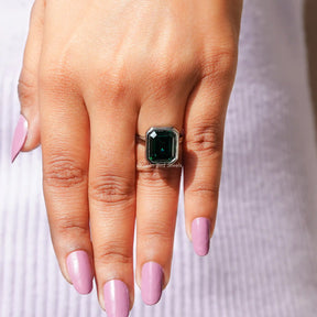 Detailed View Of Green Emerald Cut Solitaire Ring In White Gold
