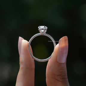 Back View of Moissanite Dutch Marquise Engagement Ring In two fingers