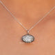 View of ice oval cut moissanite solitaire pendant 